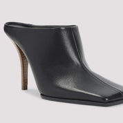 AlaÏA Mules - Black | 0ecbcc84d7a1eacfe0bc5d63f9abdbd5ff0b9b72