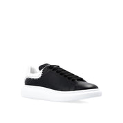 Sneakers oversize con borchie Alexander McQueen