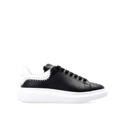 Sneakers oversize con borchie Alexander McQueen